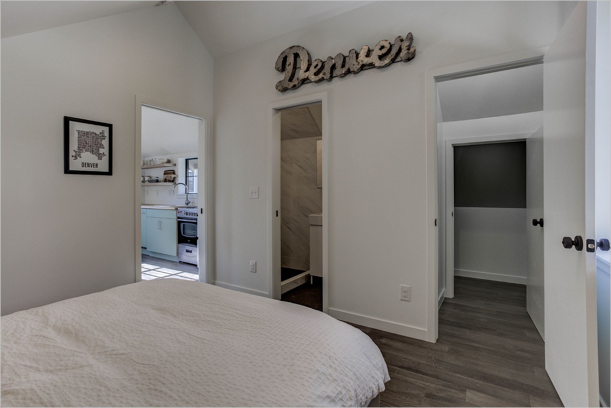Bedroom with multiple clean door openings and consistent interior trim