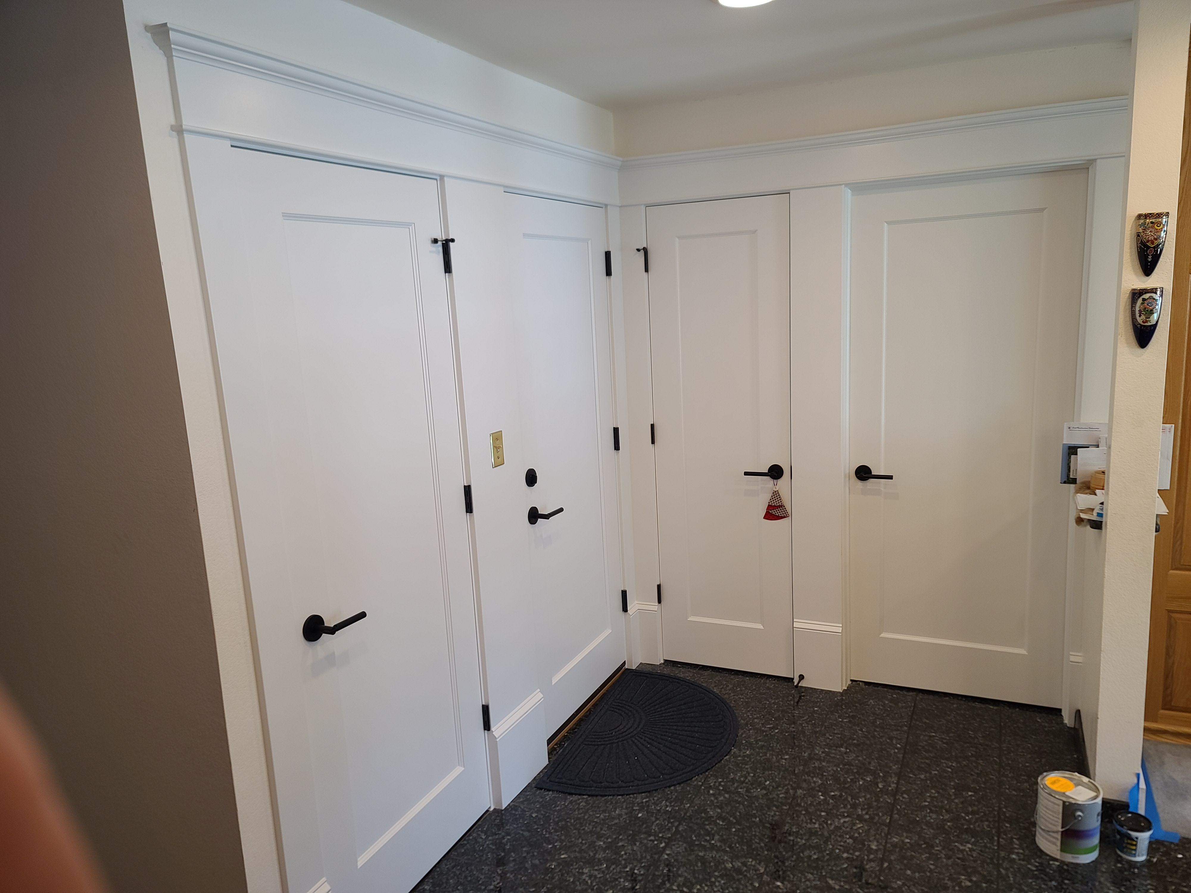 Freshly installed interior shaker doors with black hardware