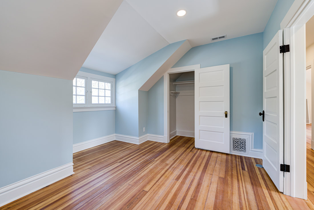 Bedroom with 5-panel Shaker closet door and trim in light blue room